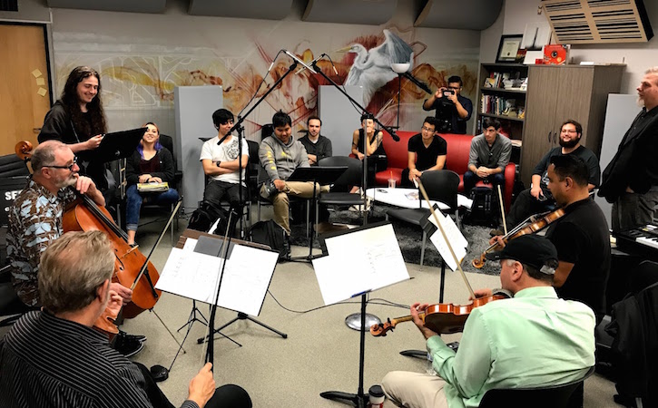 Composition students with music stands in studio