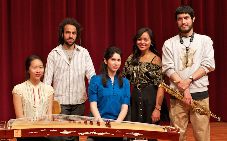 Four music students with red curtain behind them